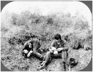 In a battlefield scene from a World War II movie parody the hero takes time out to read a Dear John letter from his girl friend.